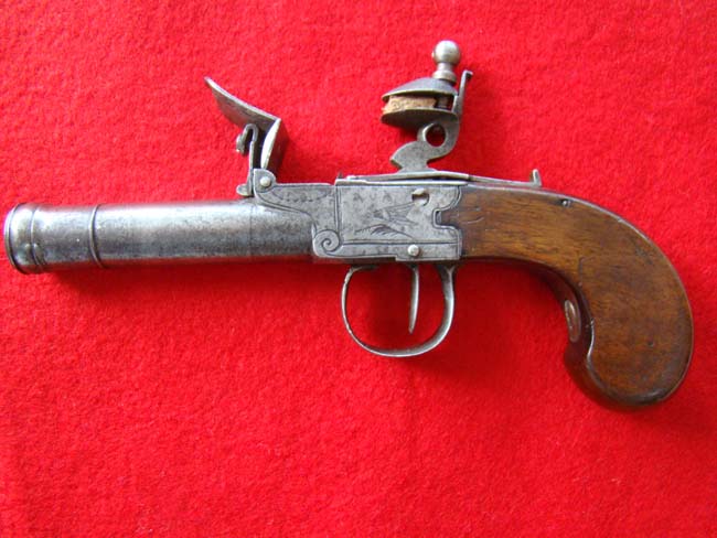 A British flintlock .50 cal. pocket pistol with cannon barrel and walnut grips circa 1790 — image 2